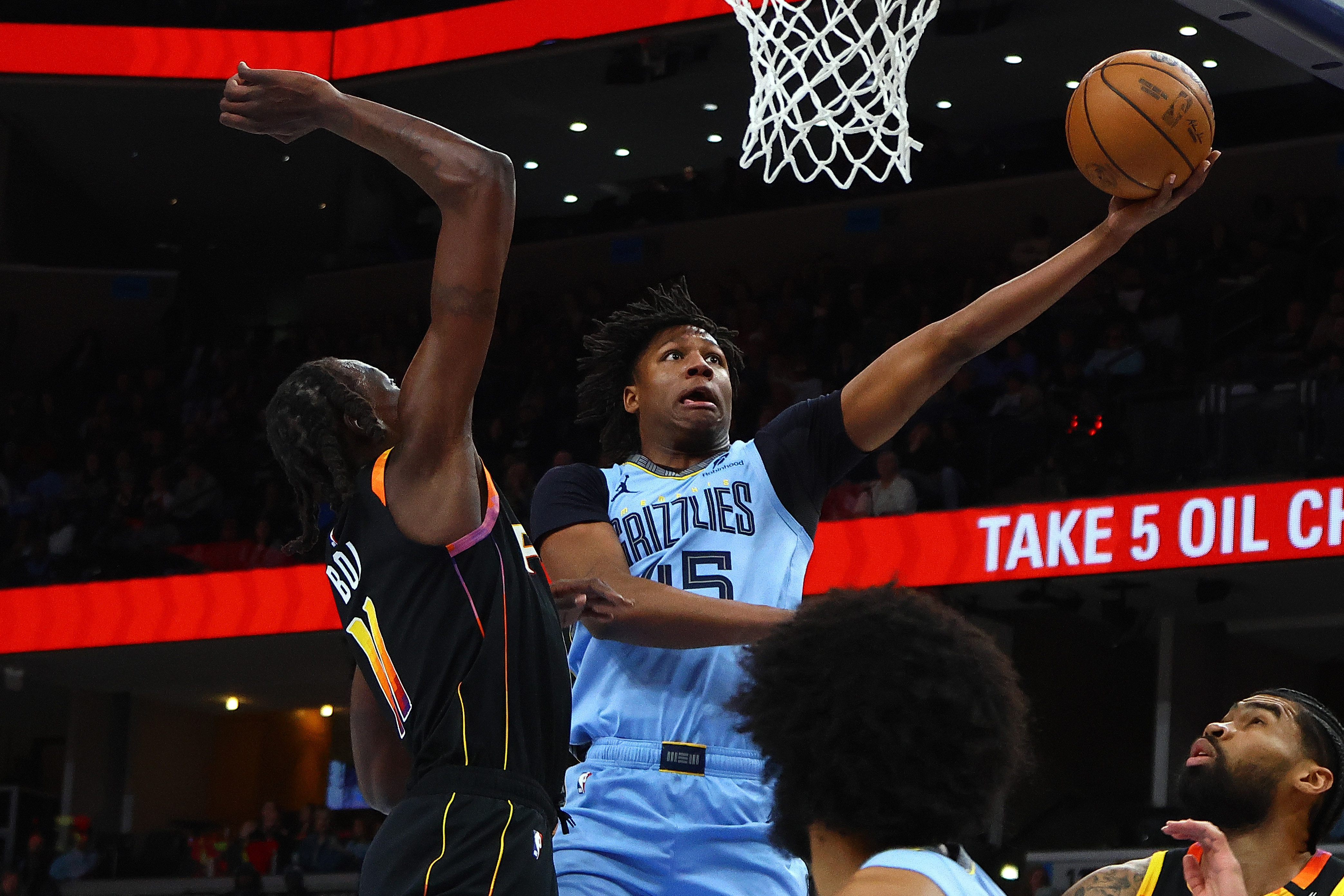 Mar 10, 2025; Memphis, Tennessee, USA; Memphis Grizzlies forward GG Jackson II (45) shoots as Phoenix Suns center Bol Bol (11) defends during the first quarter at FedExForum. Mandatory Credit: Petre Thomas-Imagn Images