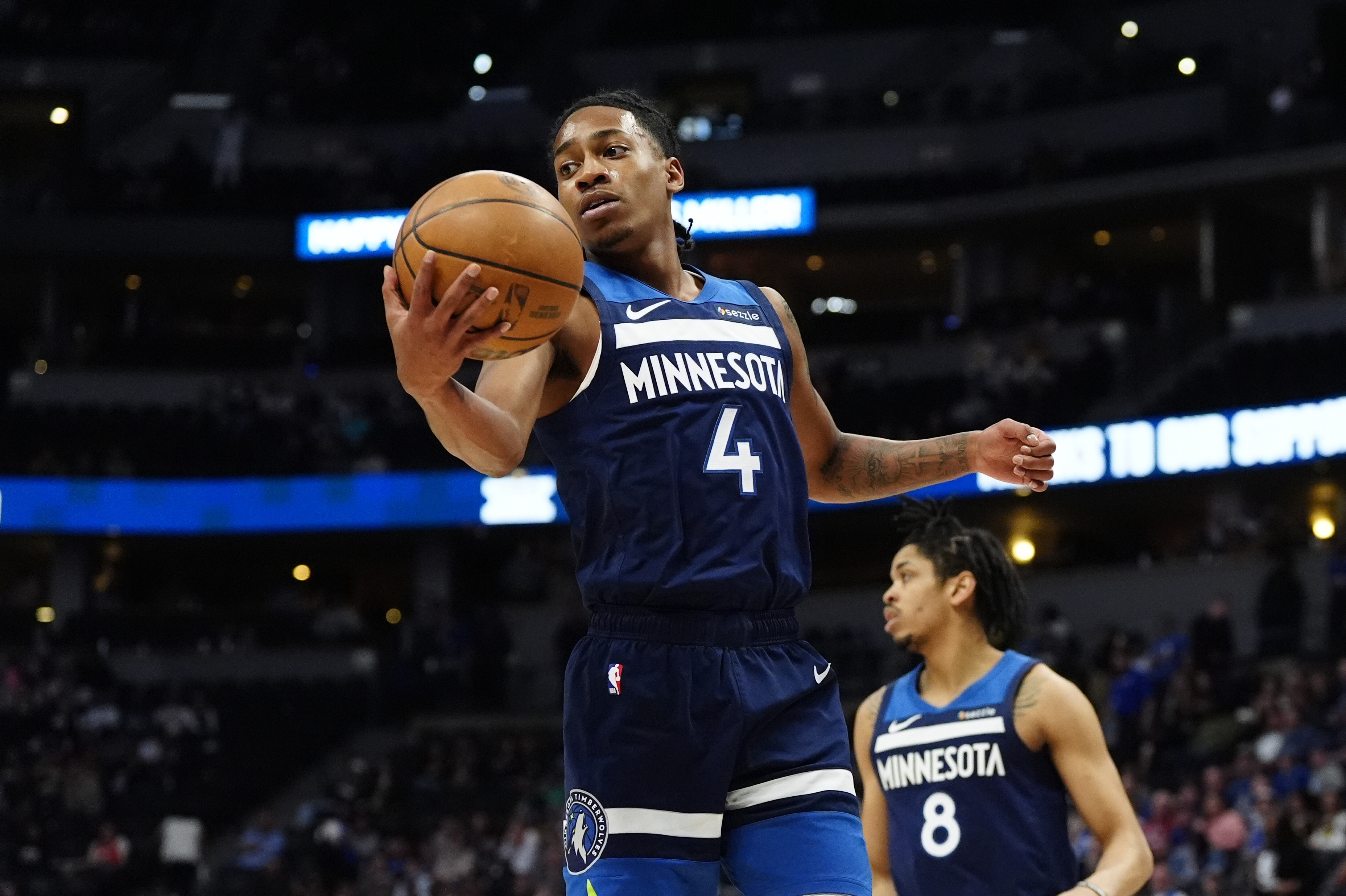 Mar 12, 2025; Denver, Colorado, USA; Minnesota Timberwolves guard Rob Dillingham (4) grabs a rebound in the fourth quarter against the Denver Nuggets at Ball Arena. Mandatory Credit: Ron Chenoy-Imagn Images