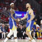 Apr 20, 2025; Houston, Texas, USA; Golden State Warriors guard Stephen Curry (30) celebrates with forward Jimmy Butler III (10) after a play during the second quarter against the Houston Rockets at Toyota Center. Mandatory Credit: Troy Taormina-Imagn Images