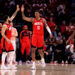 Mar 15, 2025; Houston, Texas, USA; Houston Rockets guard Fred VanVleet (5) congratulates Houston Rockets forward Jabari Smith Jr (10) against the Chicago Bulls during the fourth quarter at Toyota Center. Mandatory Credit: Erik Williams-Imagn Images