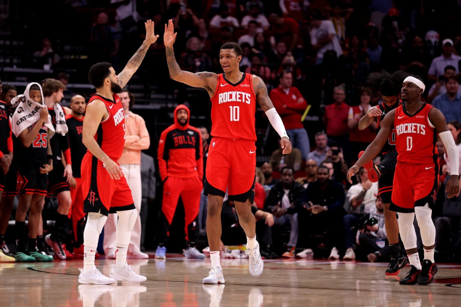Mar 15, 2025; Houston, Texas, USA; Houston Rockets guard Fred VanVleet (5) congratulates Houston Rockets forward Jabari Smith Jr (10) against the Chicago Bulls during the fourth quarter at Toyota Center. Mandatory Credit: Erik Williams-Imagn Images