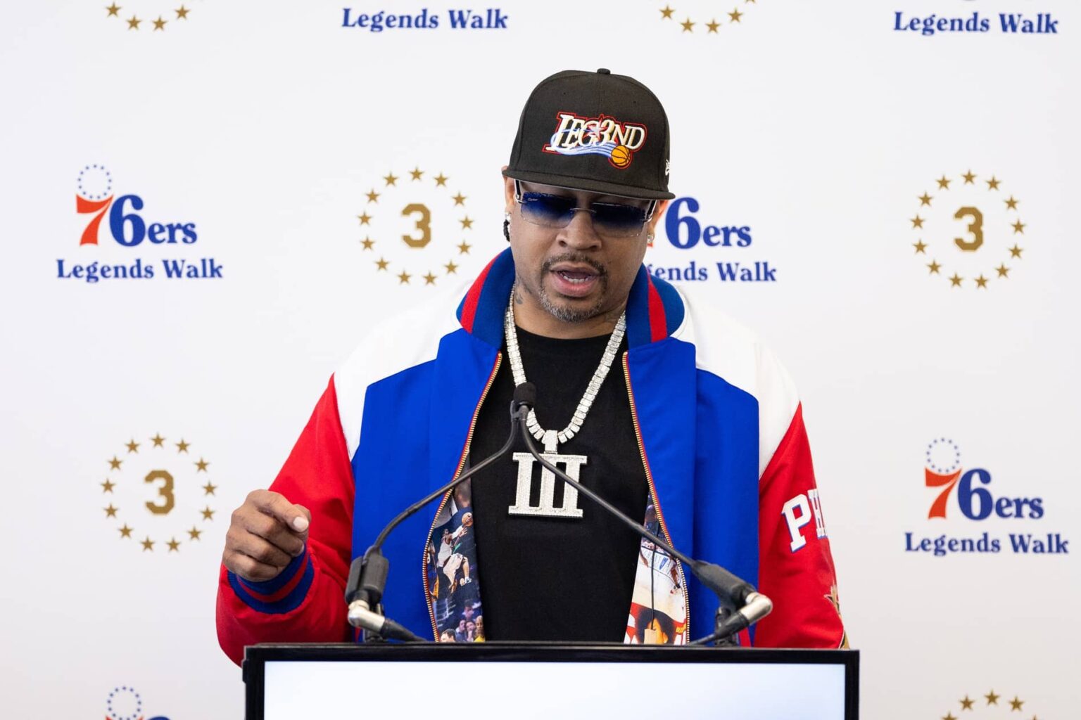 76ers great Allen Iverson speaks at the podium during the unveiling of a statue honoring him in a ceremony at Penn Medicine Philadelphia 76ers Training Complex