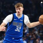 Dallas Mavericks forward Cooper Flagg (32) dribbles during the first quarter against the Washington Wizards at American Airlines Center.