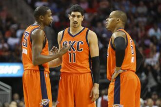 Thunder forward Kevin Durant talks with center Enes Kanter and guard Randy Foye during the second half against the Houston Rockets at Toyota Center