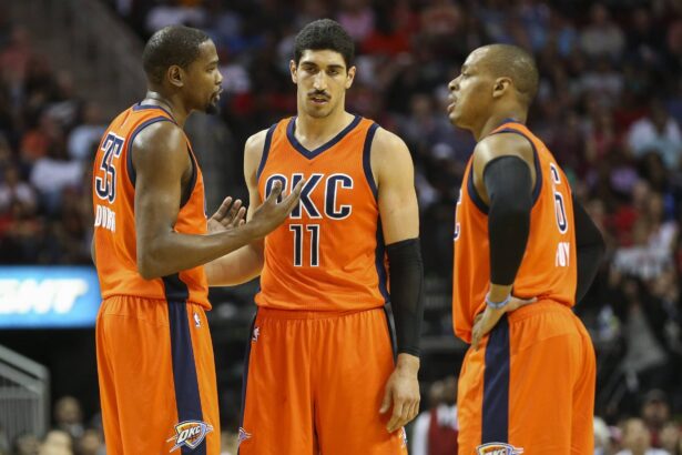 Thunder forward Kevin Durant talks with center Enes Kanter and guard Randy Foye during the second half against the Houston Rockets at Toyota Center