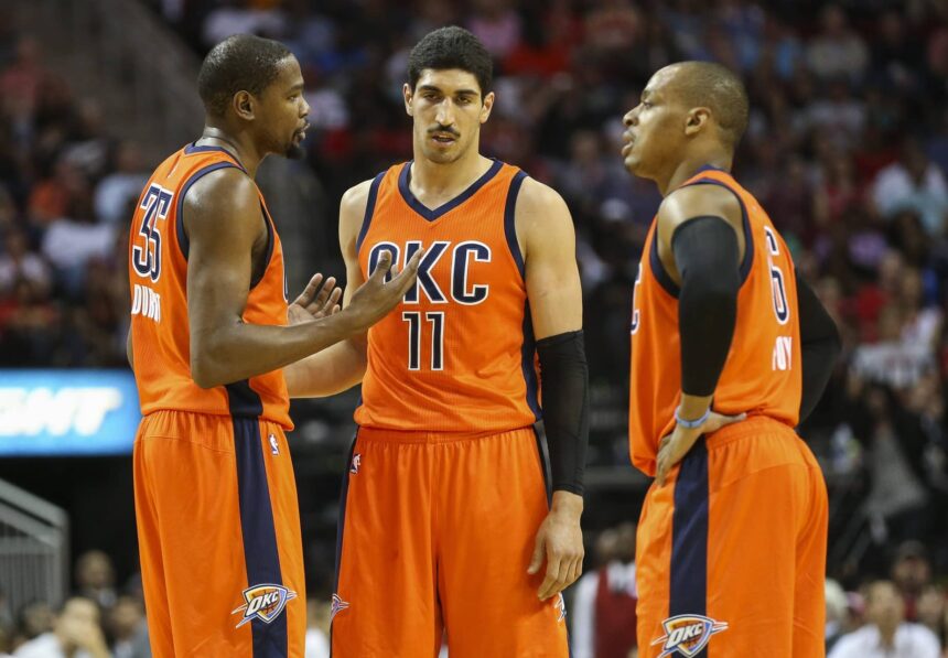 Thunder forward Kevin Durant talks with center Enes Kanter and guard Randy Foye during the second half against the Houston Rockets at Toyota Center