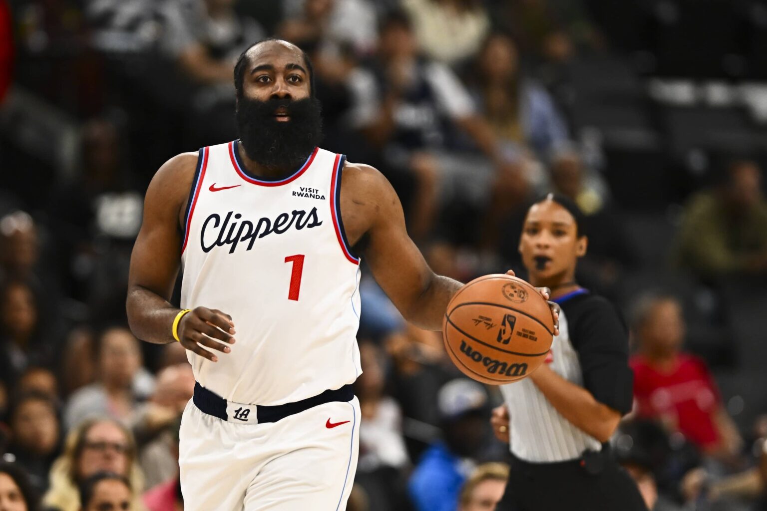 Clippers guard James Harden moves the ball against the Nuggets during the first quarter at Intuit Dome