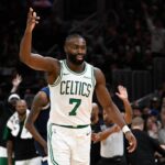 Celtics guard Jaylen Brown reacts to his three point basket against the Timberwolves during the second half at TD Garden