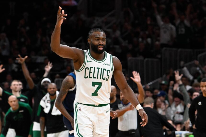 Celtics guard Jaylen Brown reacts to his three point basket against the Timberwolves during the second half at TD Garden
