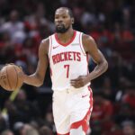 Houston Rockets forward Kevin Durant (7) brings the ball up the court during the third quarter against the Jazz at Toyota Center.