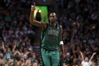Celtics center Kevin Garnett returns down court against the Toronto Raptors during the second half at the TD Garden
