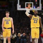 Lakers guard Austin Reaves and forward LeBron James on the court against the 76ers during the second half at Crypto.com Arena