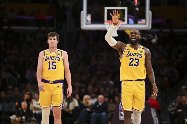 Lakers guard Austin Reaves and forward LeBron James on the court against the 76ers during the second half at Crypto.com Arena