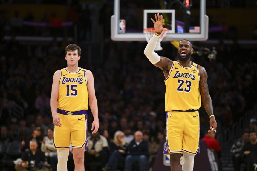 Lakers guard Austin Reaves and forward LeBron James on the court against the 76ers during the second half at Crypto.com Arena