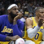 Lakers forward LeBron James and guard Russell Westbrook sit on the bench during the fourth quarter against the Kings at Golden 1 Center