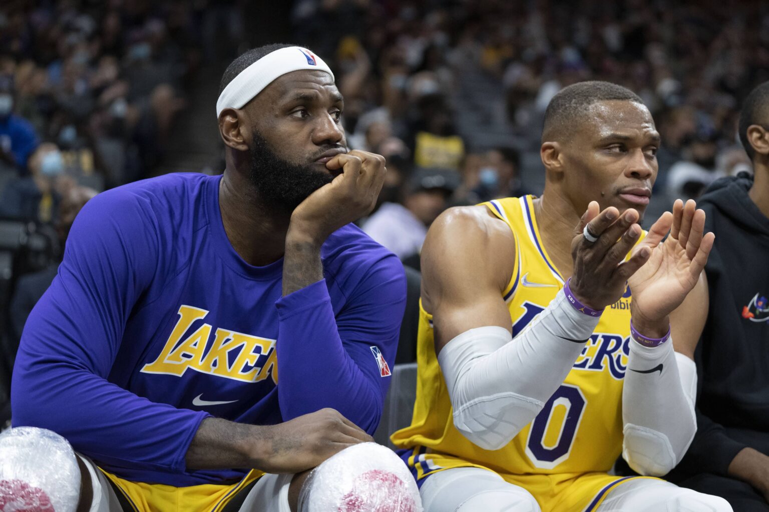 Lakers forward LeBron James and guard Russell Westbrook sit on the bench during the fourth quarter against the Kings at Golden 1 Center