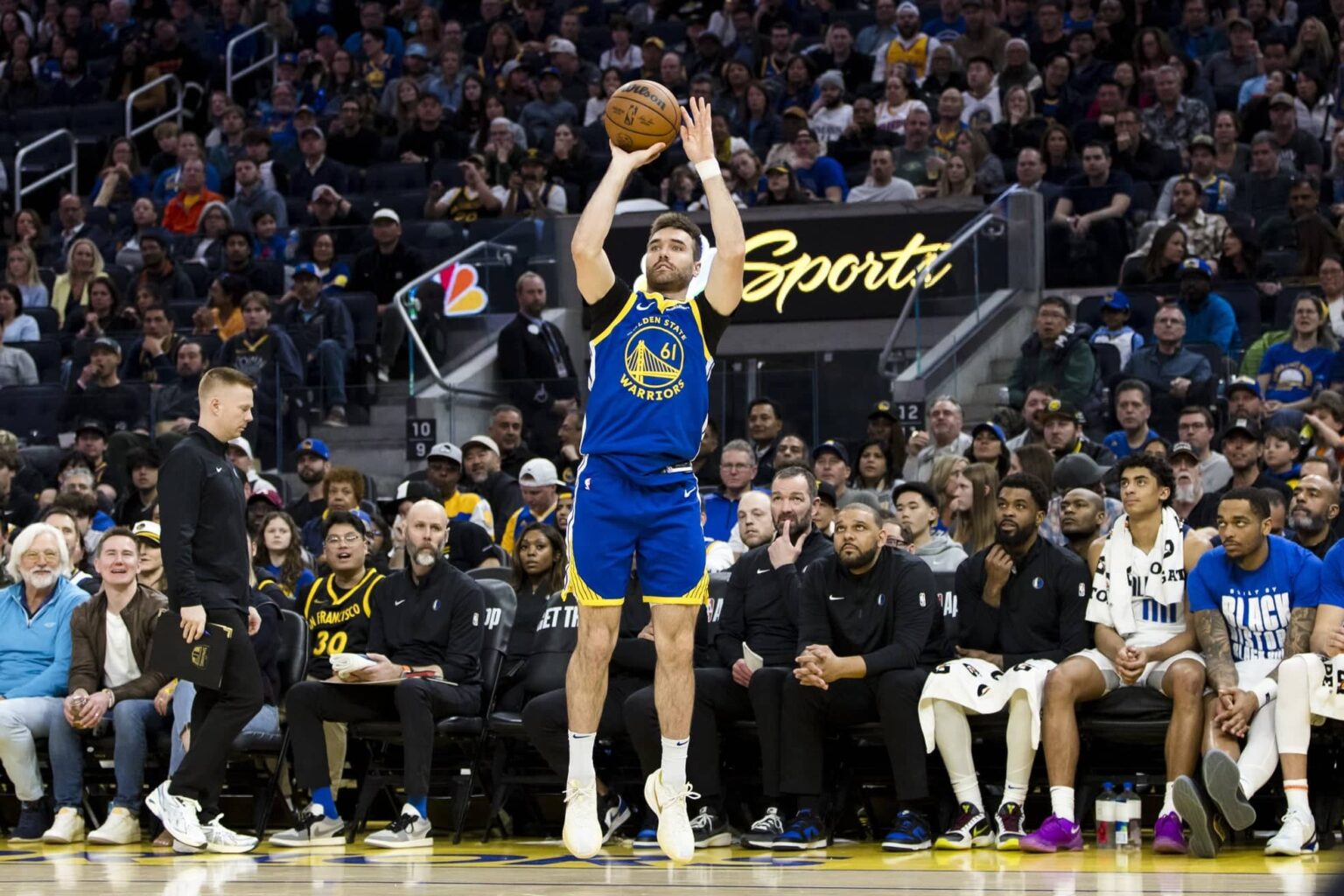 Warriors guard Pat Spencer takes a three-point shot against the Mavericks during the fourth quarter at Chase Center