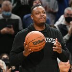 Paul Pierce carries the game ball before a game against the Raptors at the TD Garden