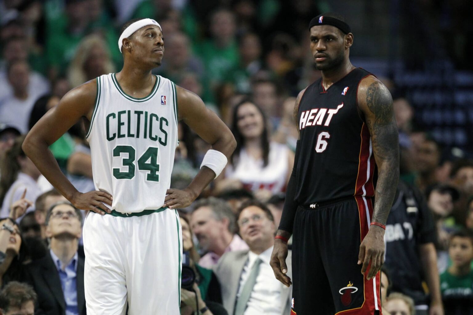 Celtics forward Paul Pierce on the court during a break in the first half with Miami Heat forward LeBron James at the TD Garden