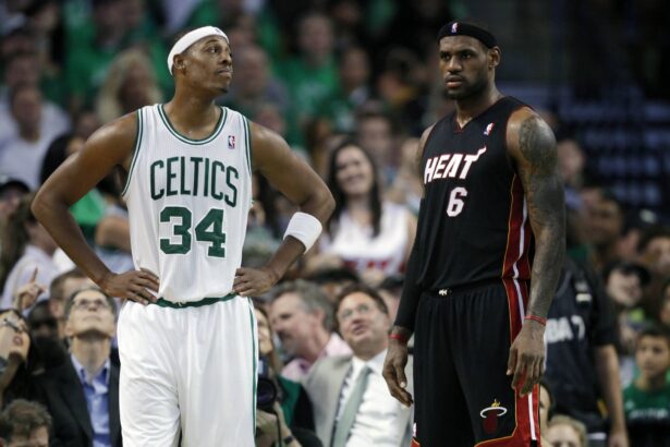 Celtics forward Paul Pierce on the court during a break in the first half with Miami Heat forward LeBron James at the TD Garden