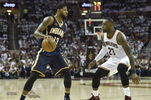 Pacers forward Paul George dribbles againstaaaa Cavaliers forward LeBron James (23) in the second quarter in game one of the first round of the 2017 NBA Playoffs at Quicken Loan