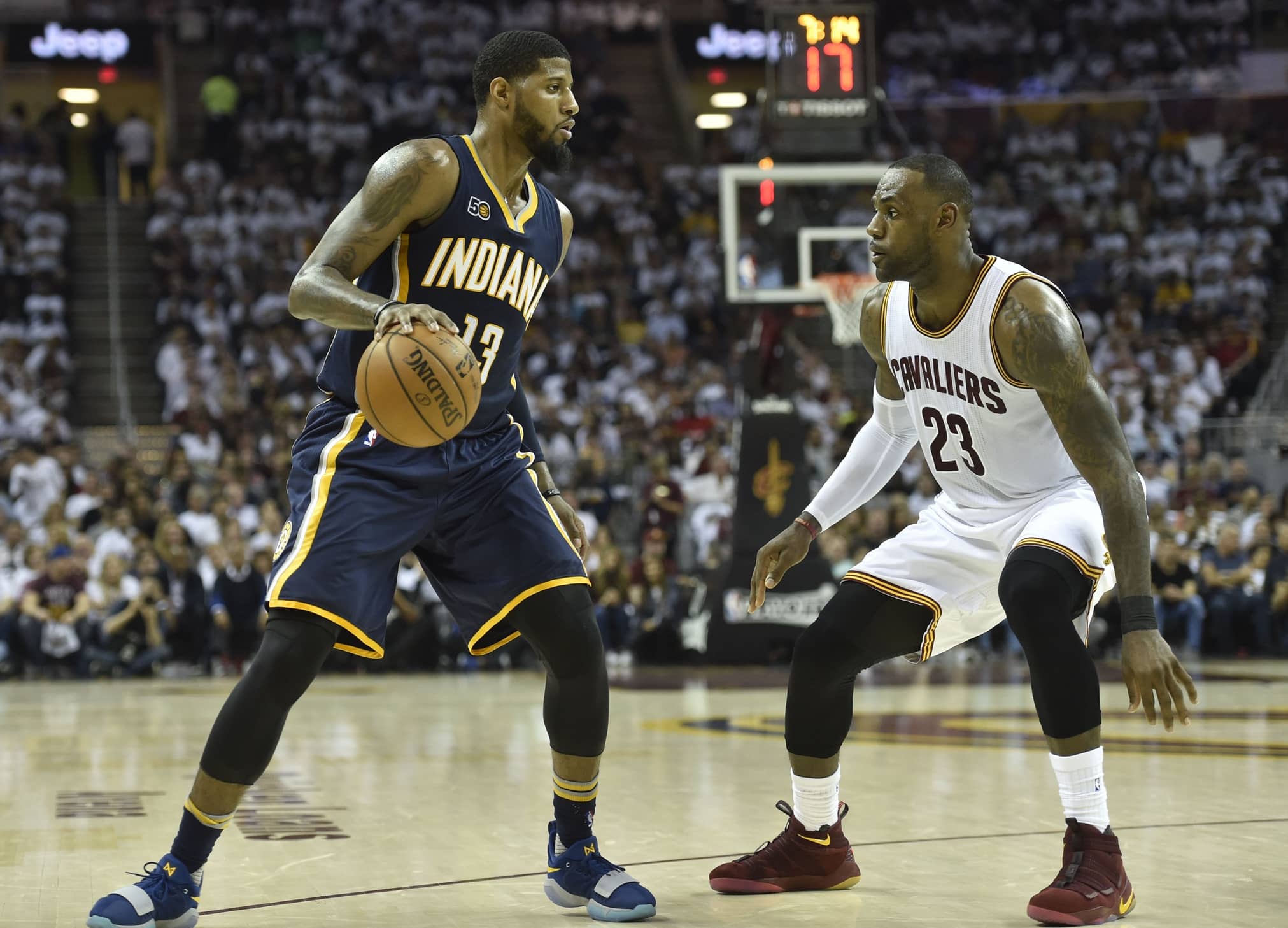 Pacers forward Paul George dribbles againstaaaa Cavaliers forward LeBron James (23) in the second quarter in game one of the first round of the 2017 NBA Playoffs at Quicken Loan