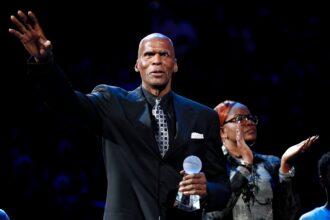 Robert Parish waves to the crowd after receiving the Sports Legacy Award on Monday, Jan. 20, 2020, before a game between the Grizzlies and Pelicans at the FedExForum in downtown Memphis. 012020grizzliespelicansnbabasketball32