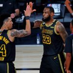 Oct 2, 2020; Orlando, Florida, USA; Los Angeles Lakers forward LeBron James (23) celebrates with guard Danny Green (14) after a play during the third quarter against the Miami Heat in game two of the 2020 NBA Finals at AdventHealth Arena. Mandatory Credit: Kim Klement-Imagn Images