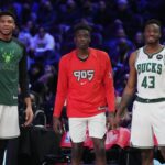 Feb 19, 2022; Cleveland, OH, USA; Team Antetokounmpo player Giannis Antetokounmpo (34), Team Antetokounmpo player Alex Antetokounmpo (29) and Team Antetokounmpo player Thanasis Antetokounmpo (43) look on during the Skills Challenge during the 2022 NBA All-Star Saturday Night at Rocket Mortgage Field House. Mandatory Credit: Kyle Terada-Imagn Images
