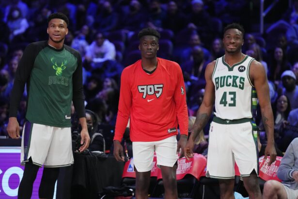 Feb 19, 2022; Cleveland, OH, USA; Team Antetokounmpo player Giannis Antetokounmpo (34), Team Antetokounmpo player Alex Antetokounmpo (29) and Team Antetokounmpo player Thanasis Antetokounmpo (43) look on during the Skills Challenge during the 2022 NBA All-Star Saturday Night at Rocket Mortgage Field House. Mandatory Credit: Kyle Terada-Imagn Images