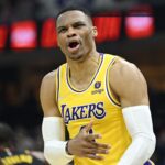 Mar 21, 2022; Cleveland, Ohio, USA; Los Angeles Lakers guard Russell Westbrook (0) reacts in the second quarter against the Cleveland Cavaliers at Rocket Mortgage FieldHouse. Mandatory Credit: David Richard-USA TODAY Sports