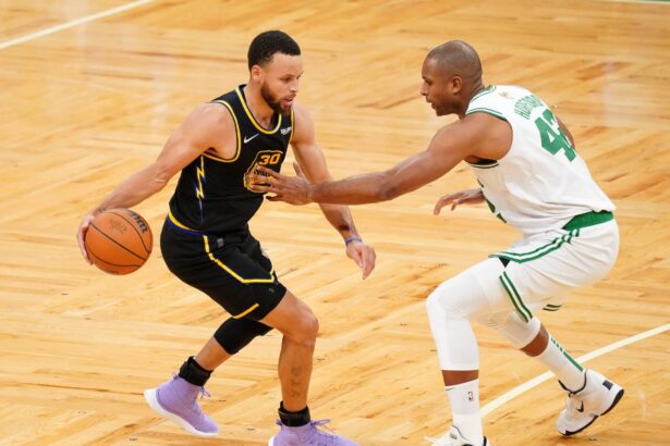 Jun 10, 2022; Boston, Massachusetts, USA; Boston Celtics center Al Horford (42) defends Golden State Warriors guard Stephen Curry (30) during the fourth quarter of game four in the 2022 NBA Finals at the TD Garden. Mandatory Credit: David Butler II-Imagn Images