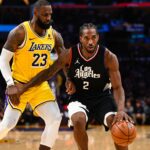 Nov 1, 2023; Los Angeles, California, USA; LA Clippers forward Kawhi Leonard (2) moves the ball against Los Angeles Lakers forward LeBron James (23) during the second half at Crypto.com Arena. Mandatory Credit: Jonathan Hui-USA TODAY Sports