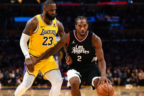 Nov 1, 2023; Los Angeles, California, USA; LA Clippers forward Kawhi Leonard (2) moves the ball against Los Angeles Lakers forward LeBron James (23) during the second half at Crypto.com Arena. Mandatory Credit: Jonathan Hui-USA TODAY Sports