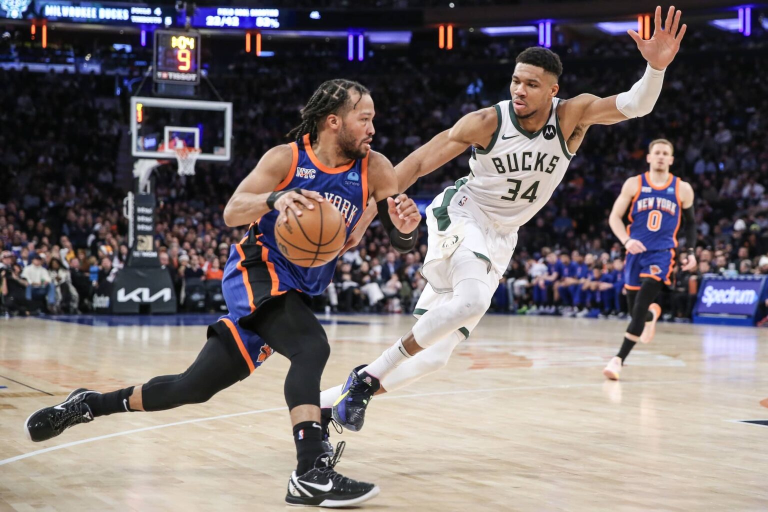 Dec 23, 2023; New York, New York, USA; New York Knicks guard Jalen Brunson (11) looks to drive past Milwaukee Bucks forward Giannis Antetokounmpo (34) in the second quarter at Madison Square Garden. Mandatory Credit: Wendell Cruz-Imagn Images
