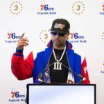 Apr 12, 2024; Camden, NJ, USA; Philadelphia 76ers great Allen Iverson speaks at the podium during the unveiling of a statue honoring him in a ceremony at Penn Medicine Philadelphia 76ers Training Complex. Mandatory Credit: Bill Streicher-Imagn Images