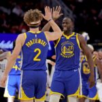 Nov 2, 2024; Houston, Texas, USA; Golden State Warriors forward Draymond Green (23) congratulates guard Brandin Podziemski (2) after a basket against the Houston Rockets during the second quarter at Toyota Center. Mandatory Credit: Erik Williams-Imagn Images
