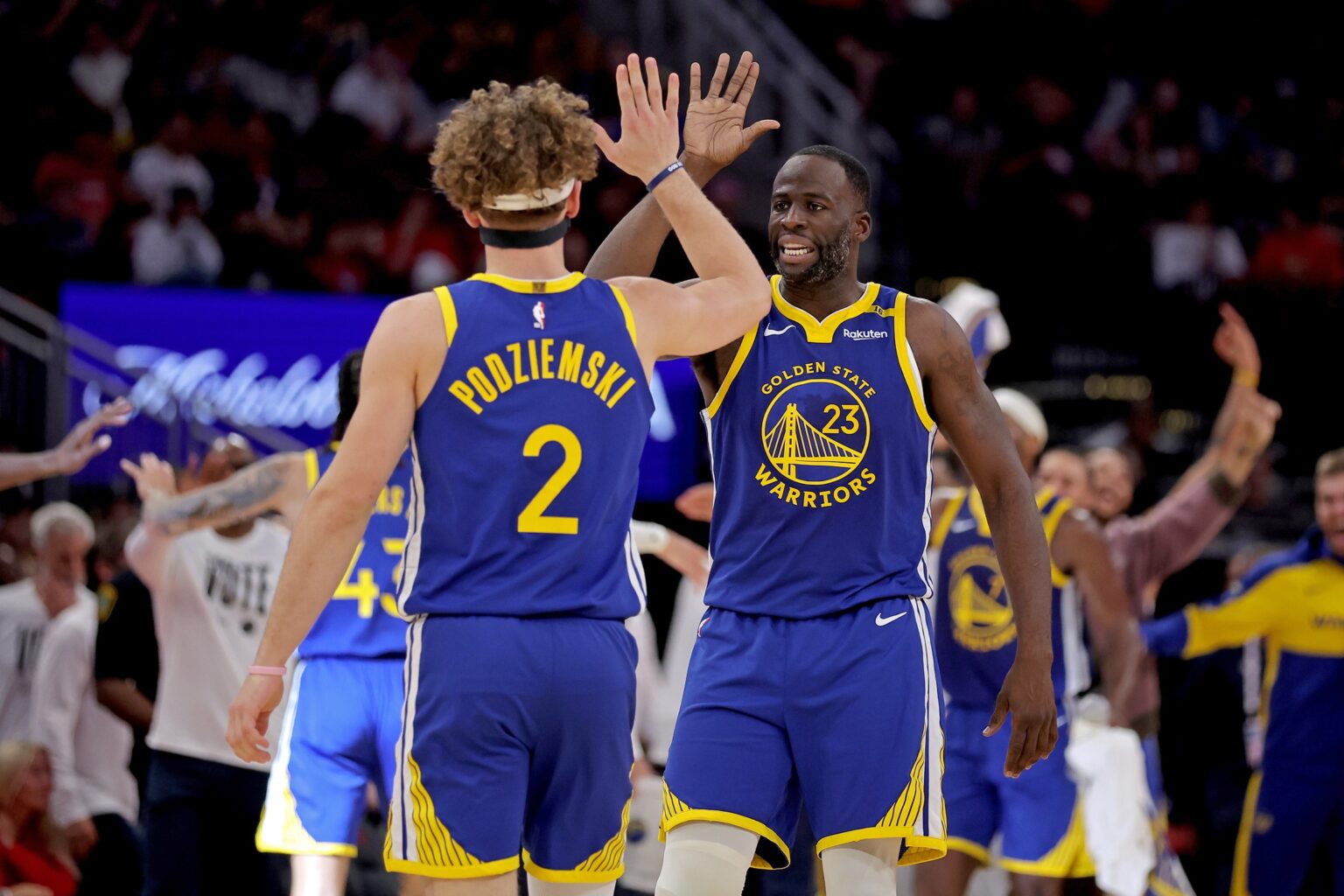Nov 2, 2024; Houston, Texas, USA; Golden State Warriors forward Draymond Green (23) congratulates guard Brandin Podziemski (2) after a basket against the Houston Rockets during the second quarter at Toyota Center. Mandatory Credit: Erik Williams-Imagn Images