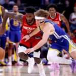 Nov 2, 2024; Houston, Texas, USA; Houston Rockets forward Tari Eason (17) and Golden State Warriors guard Brandin Podziemski (2) dive for the ball during the fourth quarter at Toyota Center. Mandatory Credit: Erik Williams-Imagn Images