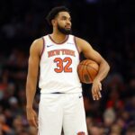 Nov 20, 2024; Phoenix, Arizona, USA; New York Knicks center Karl-Anthony Towns (32) against the Phoenix Suns at Footprint Center. Mandatory Credit: Mark J. Rebilas-Imagn Images