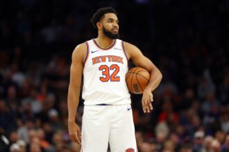 Nov 20, 2024; Phoenix, Arizona, USA; New York Knicks center Karl-Anthony Towns (32) against the Phoenix Suns at Footprint Center. Mandatory Credit: Mark J. Rebilas-Imagn Images