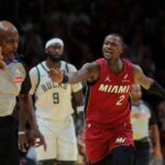Nov 26, 2024; Miami, Florida, USA; Miami Heat guard Terry Rozier (2) reacts toward referee Tom Washington (49) after shooting the basketball against the Milwaukee Bucks during the fourth quarter at Kaseya Center. Mandatory Credit: Sam Navarro-Imagn Images