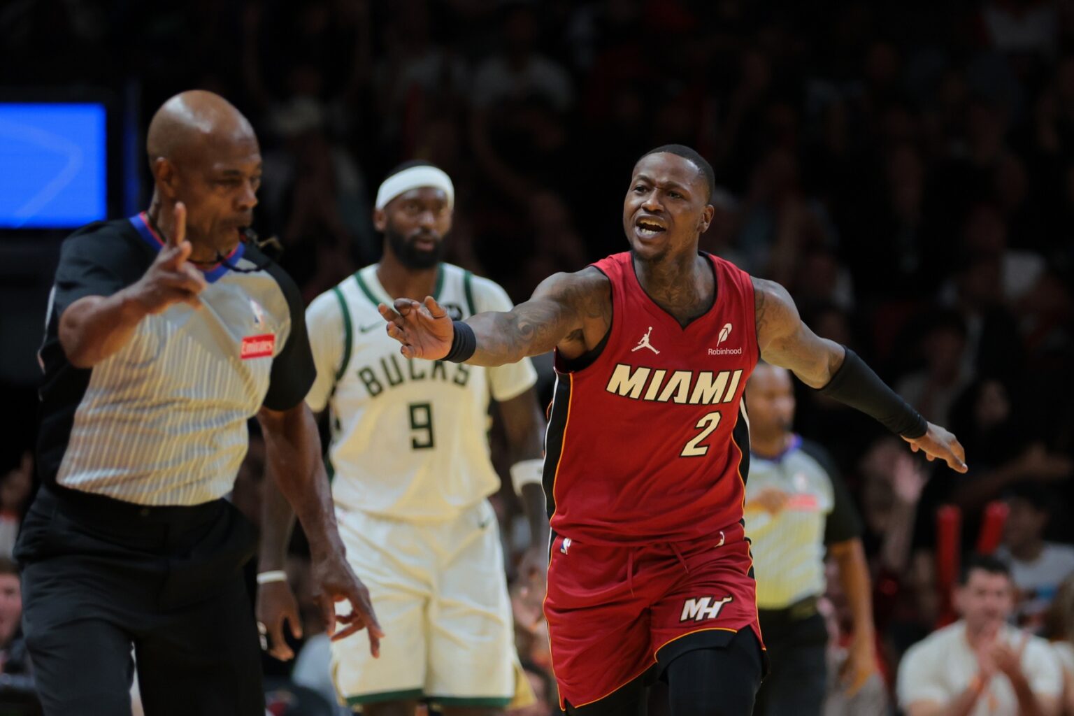 Nov 26, 2024; Miami, Florida, USA; Miami Heat guard Terry Rozier (2) reacts toward referee Tom Washington (49) after shooting the basketball against the Milwaukee Bucks during the fourth quarter at Kaseya Center. Mandatory Credit: Sam Navarro-Imagn Images