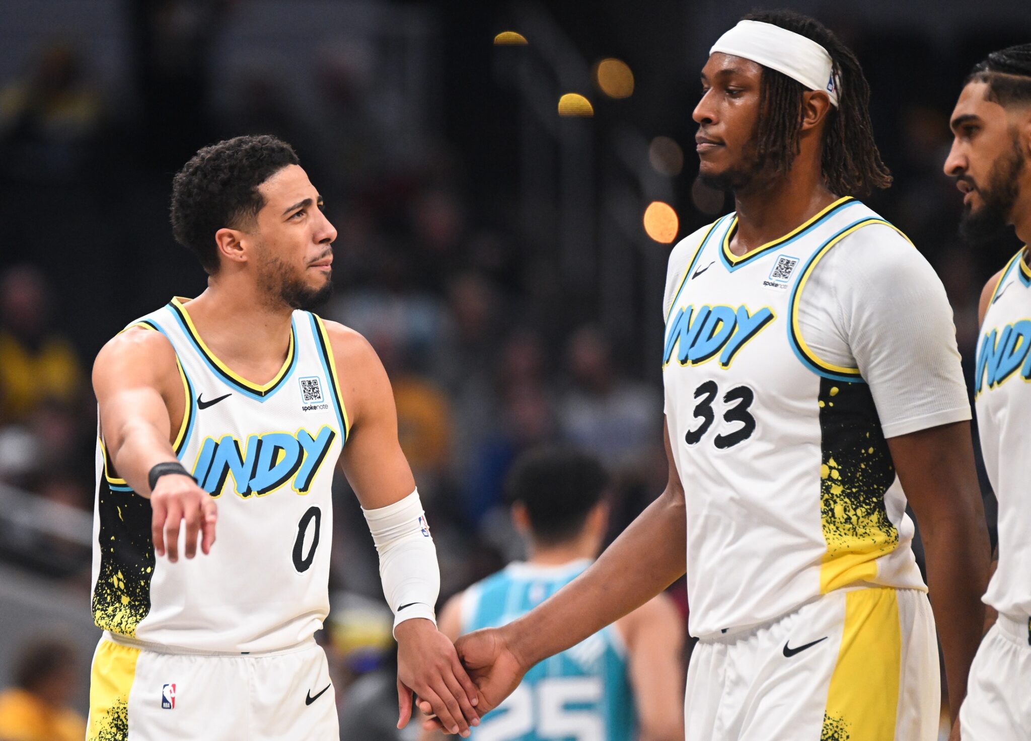 Dec 8, 2024; Indianapolis, Indiana, USA; Indiana Pacers guard Tyrese Haliburton (0) and Indiana Pacers center Myles Turner (33) talk during a timeout during the first half against the Charlotte Hornets at Gainbridge Fieldhouse. Mandatory Credit: Robert Goddin-Imagn Images