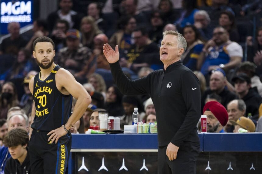 Dec 30, 2024; San Francisco, California, USA; Golden State Warriors guard Stephen Curry (30) watches as head coach Steve Kerr reacts during the first quarter of the game against the Cleveland Cavaliers against the Cleveland Cavaliers at Chase Center. Mandatory Credit: John Hefti-Imagn Images