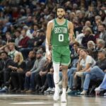 Jan 2, 2025; Minneapolis, Minnesota, USA; Boston Celtics forward Jayson Tatum (0) pumps his fist after making a shot against the Minnesota Timberwolves in the second half at Target Center. Mandatory Credit: Jesse Johnson-Imagn Images