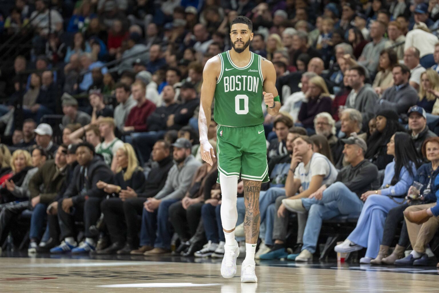Jan 2, 2025; Minneapolis, Minnesota, USA; Boston Celtics forward Jayson Tatum (0) pumps his fist after making a shot against the Minnesota Timberwolves in the second half at Target Center. Mandatory Credit: Jesse Johnson-Imagn Images