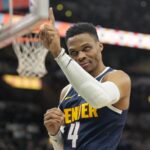 Jan 4, 2025; San Antonio, Texas, USA; Denver Nuggets guard Russell Westbrook (4) interacts with a fan before a game the San Antonio Spurs at Frost Bank Center. Mandatory Credit: Scott Wachter-Imagn Images