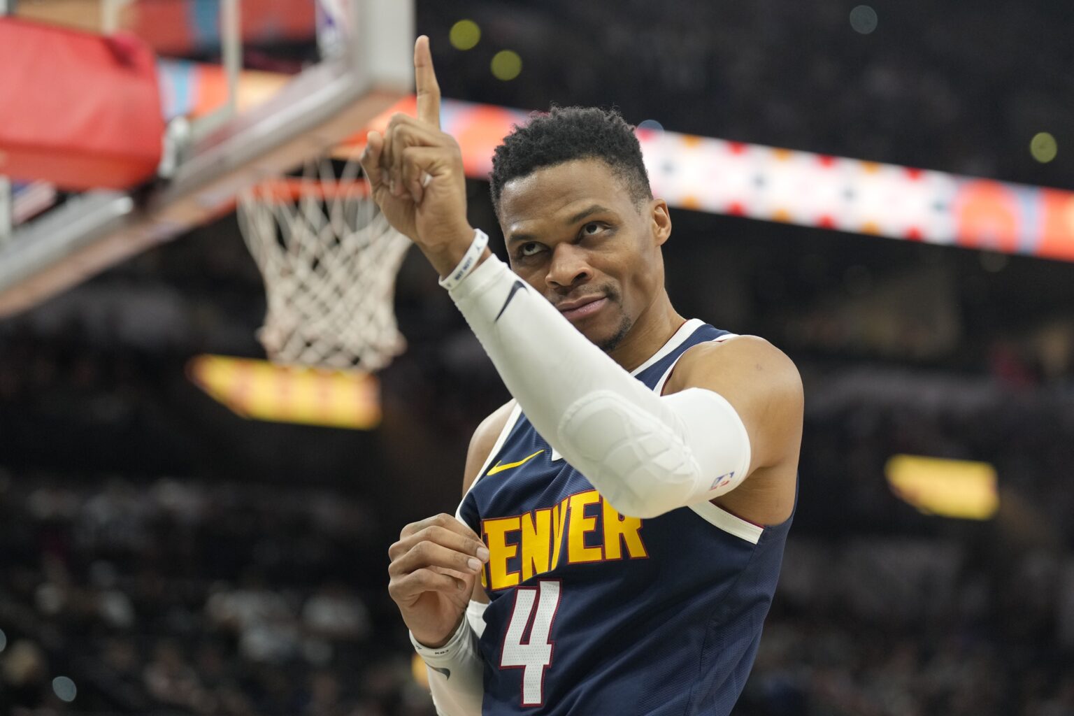 Jan 4, 2025; San Antonio, Texas, USA; Denver Nuggets guard Russell Westbrook (4) interacts with a fan before a game the San Antonio Spurs at Frost Bank Center. Mandatory Credit: Scott Wachter-Imagn Images