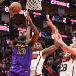 Jan 5, 2025; Houston, Texas, USA; Los Angeles Lakers forward LeBron James (23) makes a basket against Houston Rockets center Alperen Sengun (28) in the fourth quarter at Toyota Center. Mandatory Credit: Thomas Shea-Imagn Images